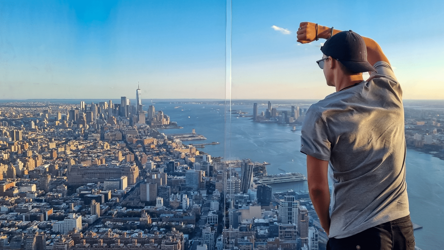 A man looking out at the city during a one-day sightseeing tour