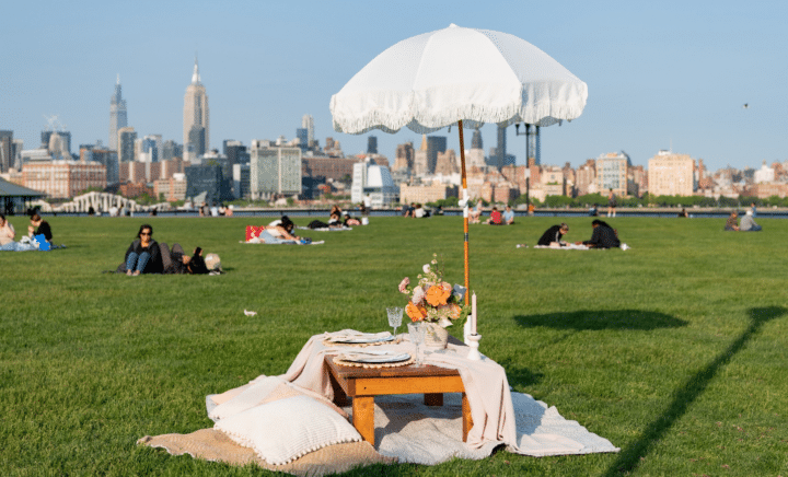 A picnic table set up in Central Park as part of the New York City travel guide