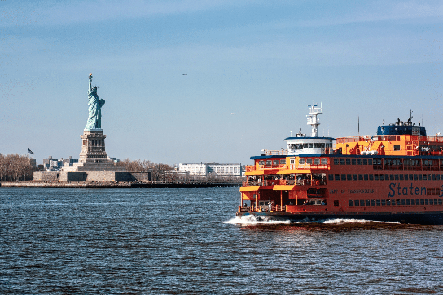 The Staten Island Ferry with the Statue of Liberty in the background