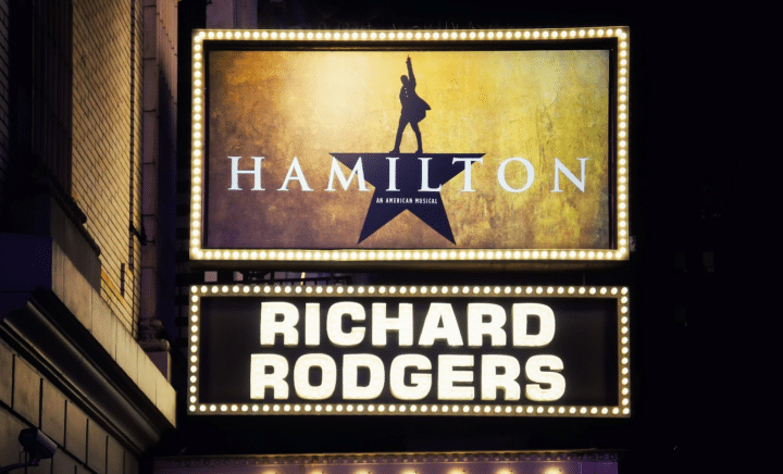 A signboard for Hamilton seen during a New York City travel guide