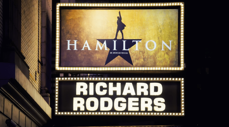 A signboard for Hamilton seen during a New York City travel guide