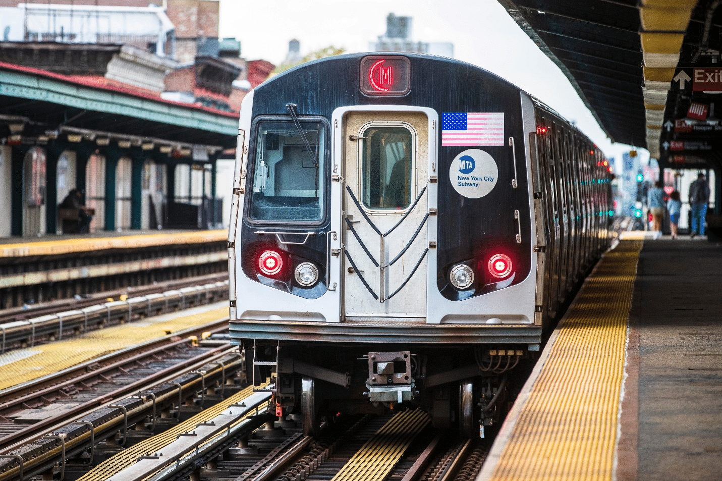 A train at a station seen by asmall group tour in New York City