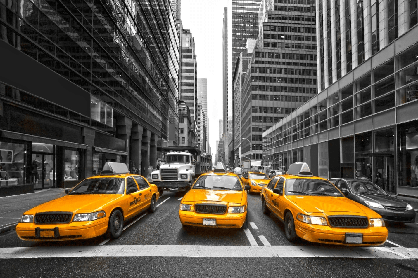 Three taxis on a street seen during aguided sightseeing tour