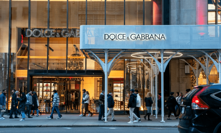 People walking in front of a store during a New York City travel guide