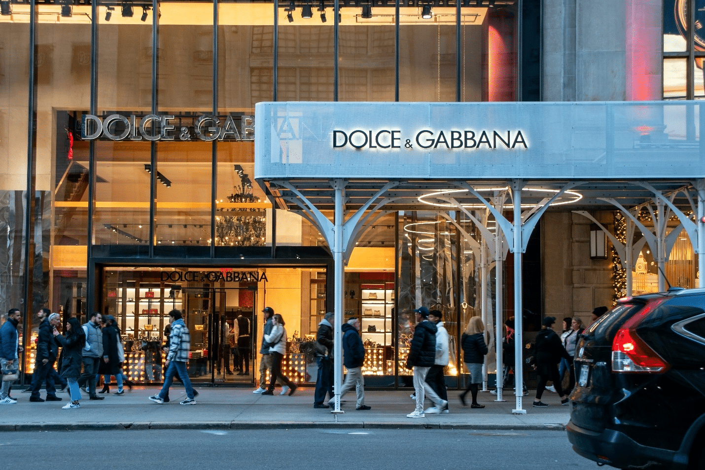 People walking in front of a store during a New York City travel guide