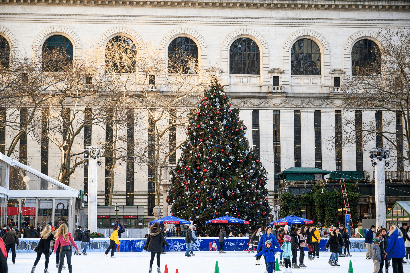 A crowd of people ice skating during a small group tour in New York City