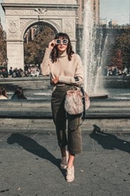 A woman in front of a fountain during a one-day sightseeing tour