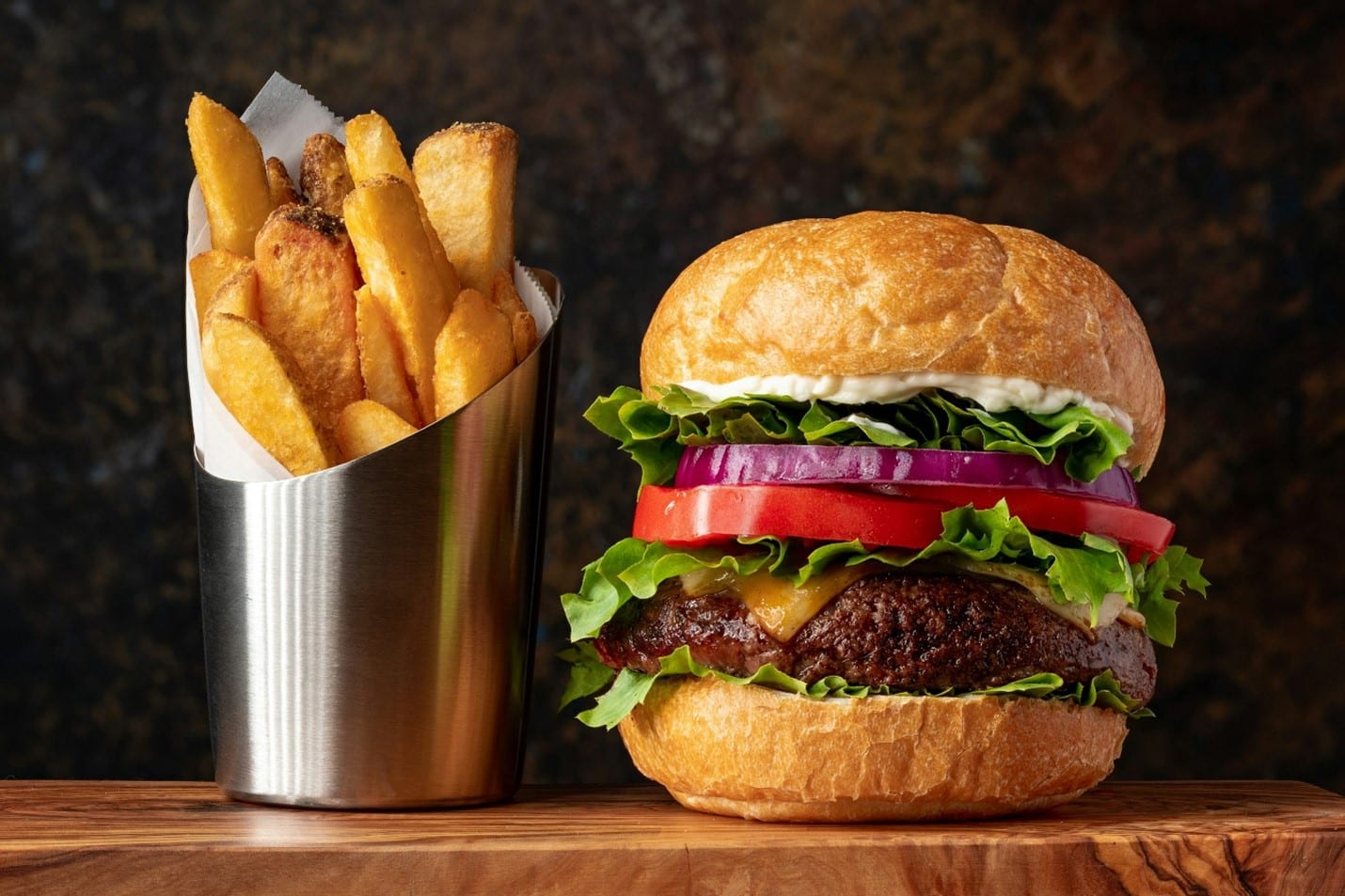 A burger and a side of fries eaten during a small group tour in New York City