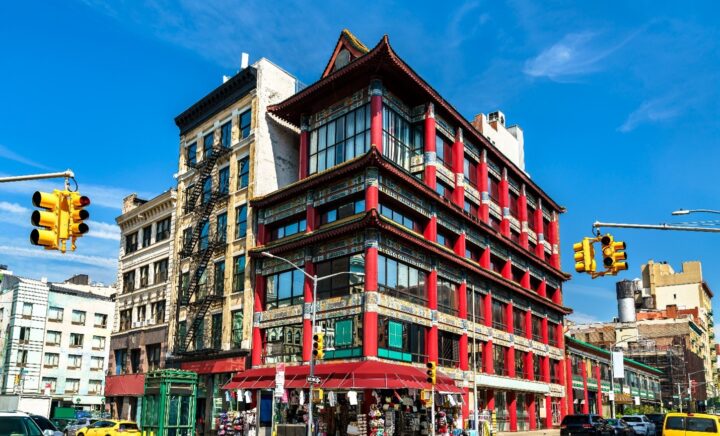 A large red building in Chinatown seen during a New York City travel guide
