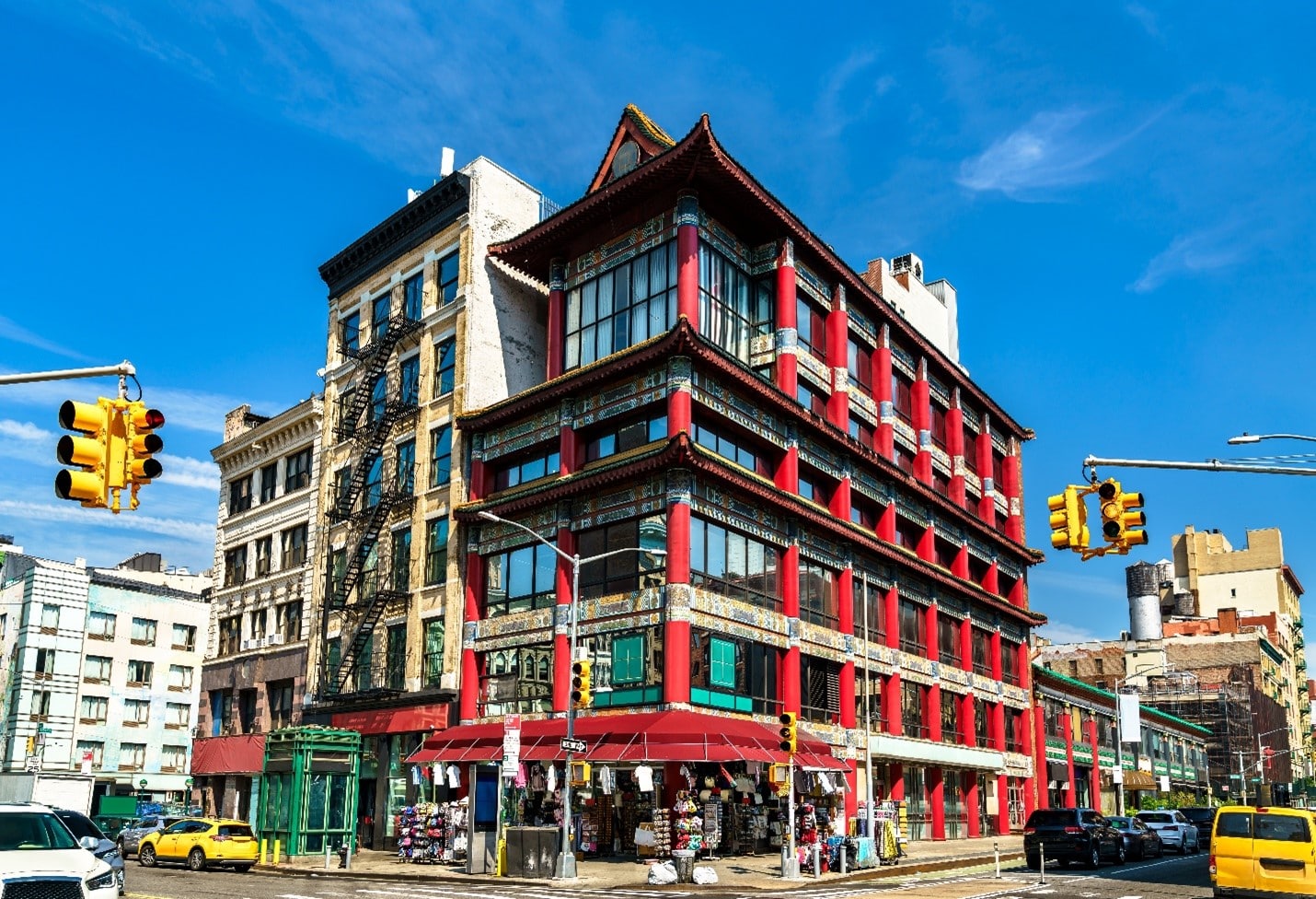 A large red building in Chinatown seen during a New York City travel guide
