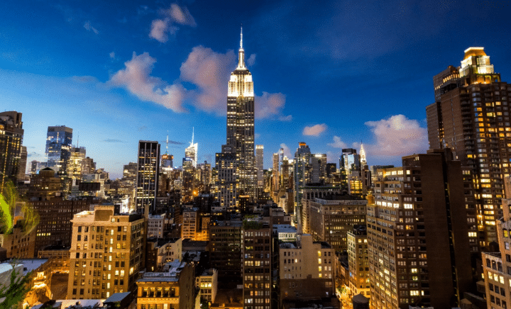 City skyline at night seen during a New York City travel guide