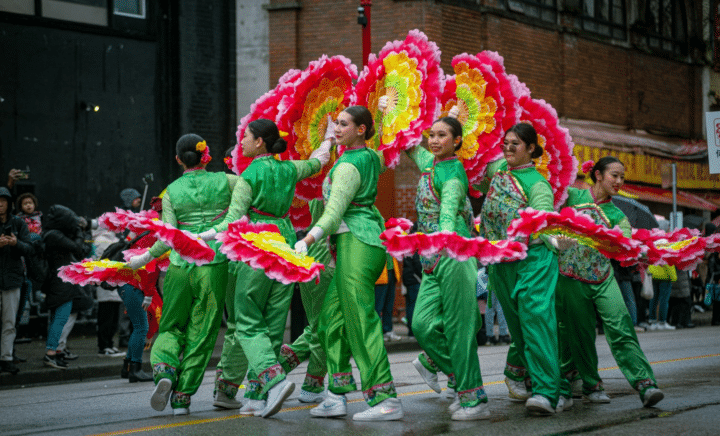 Women dancing during a New York City travel guide