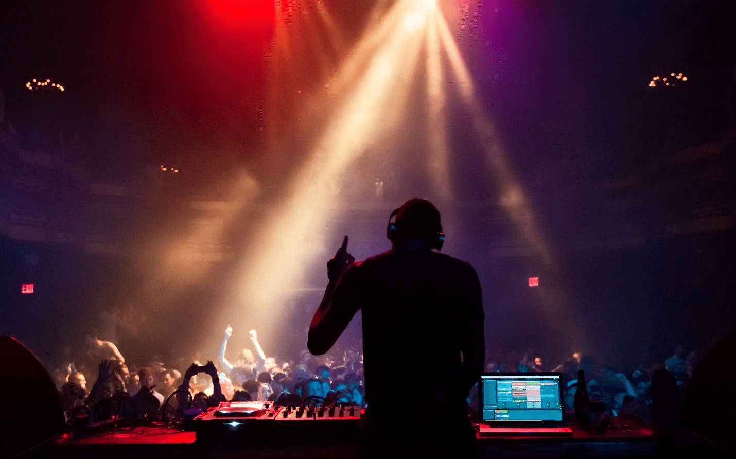 A DJ playing music at the club