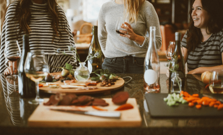 A group of women eating together during a New York City travel guide