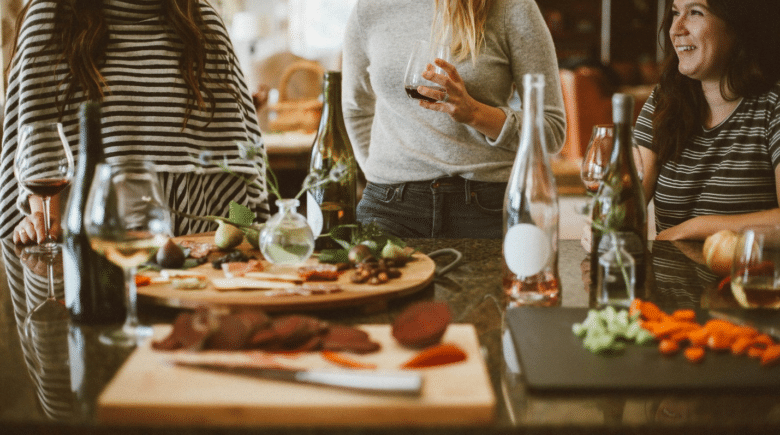 A group of women eating together during a New York City travel guide
