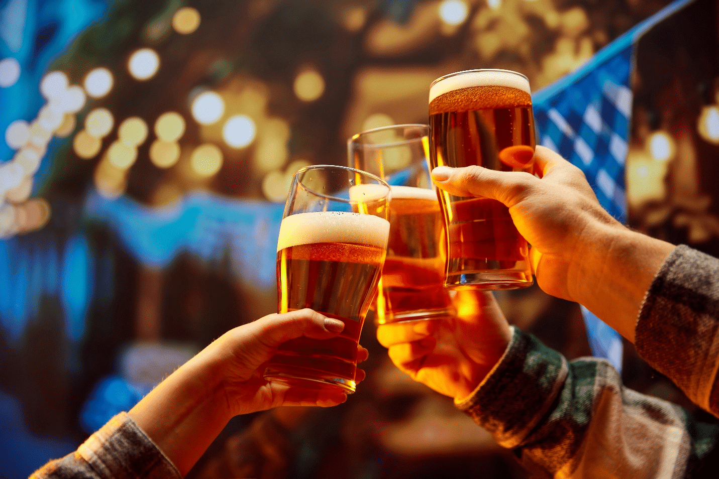 People holding up beer during a one-day sightseeing tour