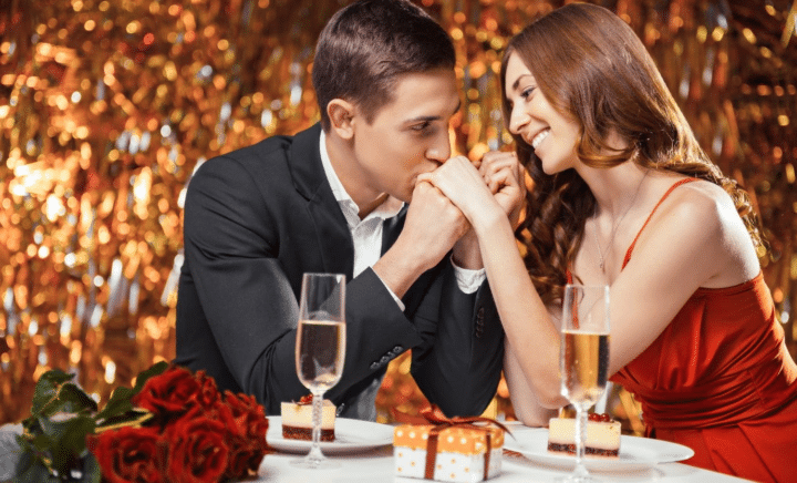 A beautiful couple sharing a romantic moment under sparkling lights.