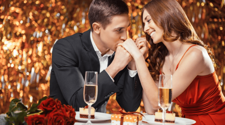 A beautiful couple sharing a romantic moment under sparkling lights.