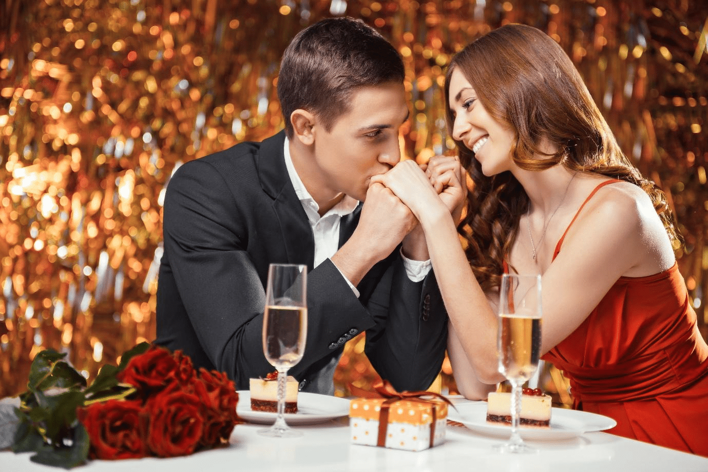 A beautiful couple sharing a romantic moment under sparkling lights.