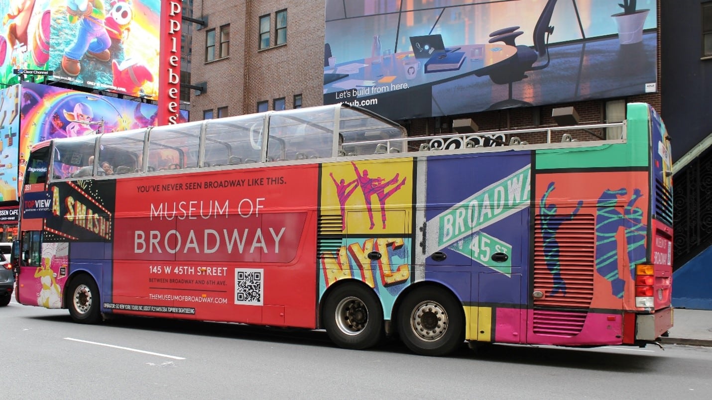 A bus advertising the Museum of Broadway seen during a one-day sightseeing tour