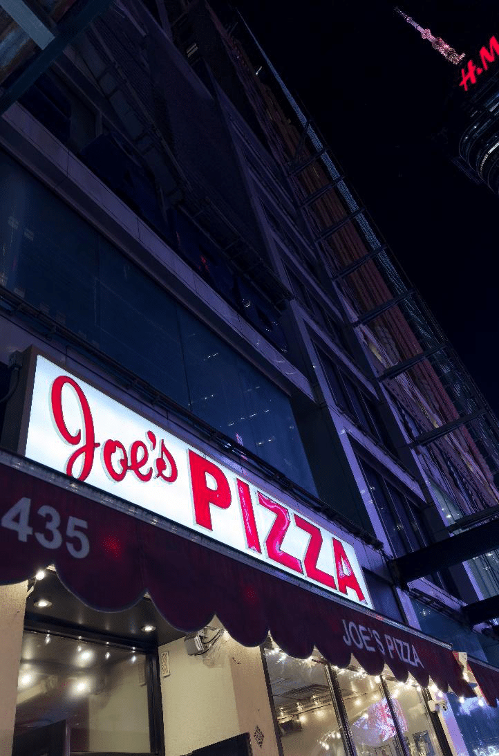 The iconic Joe’s Pizza storefront.