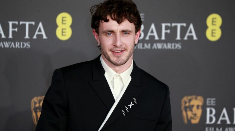 A blue eyed and black-haired male actor during a New York City travel guide
