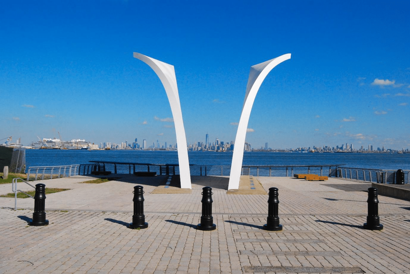 The Staten Island September 11th Memorial with its twin structures framing the Manhattan skyline.