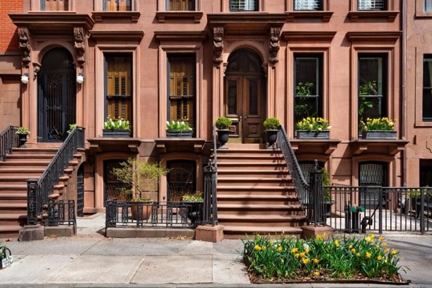 A row of historic brownstone townhouses in New York City