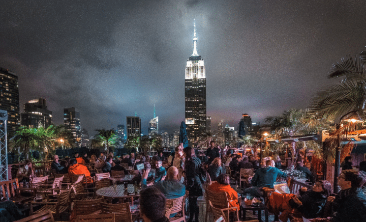 People at a bar during a New York City travel guide
