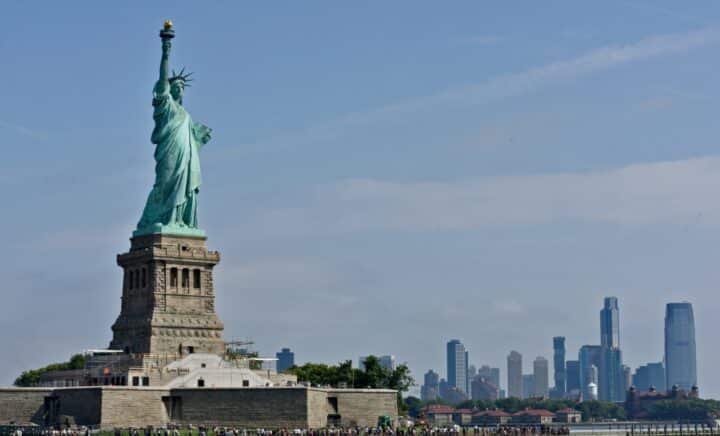The Statue of Liberty with the Manhattan Skyline in the background