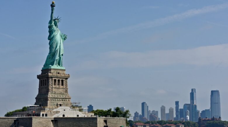 The Statue of Liberty with the Manhattan Skyline in the background
