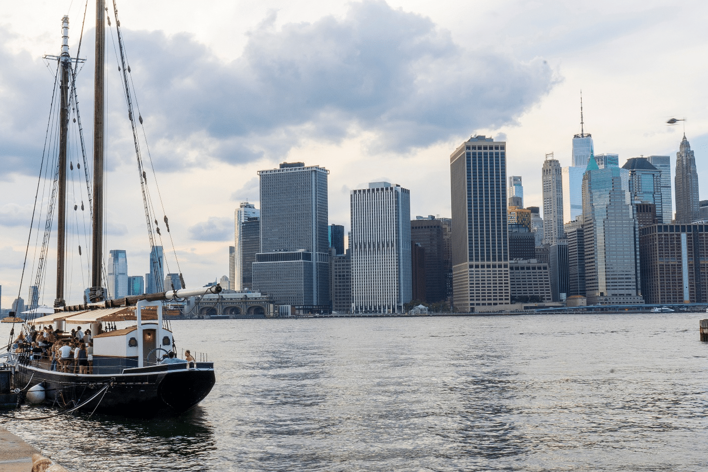 The Pilot Bar on a vintage boat docked in New York City, offering waterfront views.