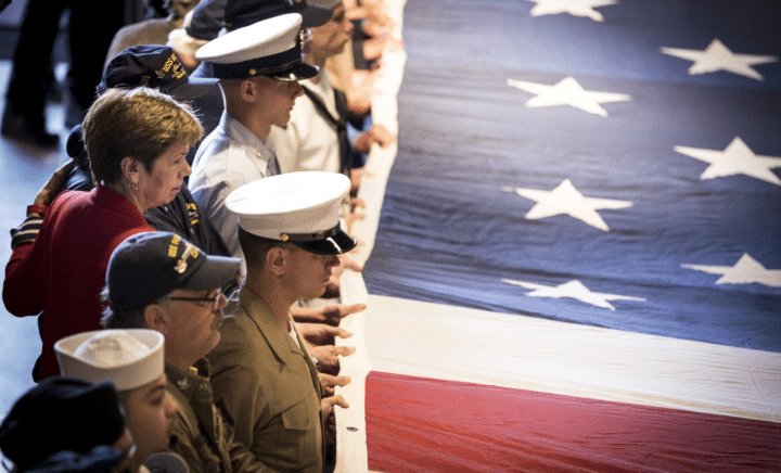 American soldiers holding an American flag during a New York City travel guide