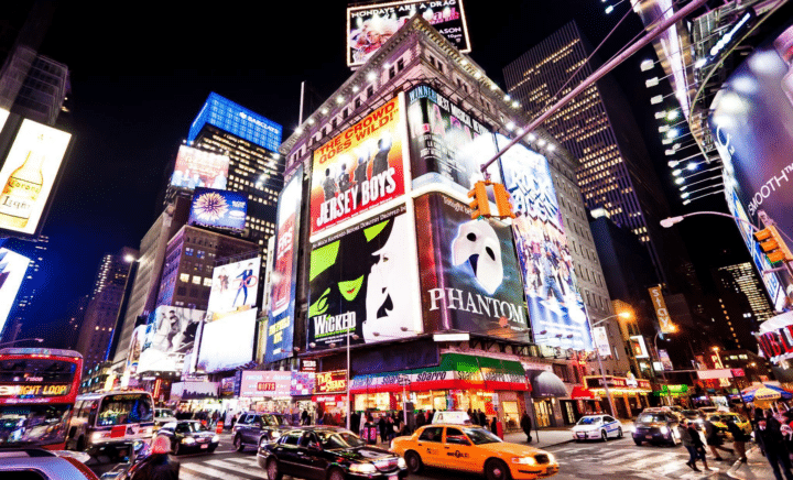 Theater marquees illuminate Broadway in New York.