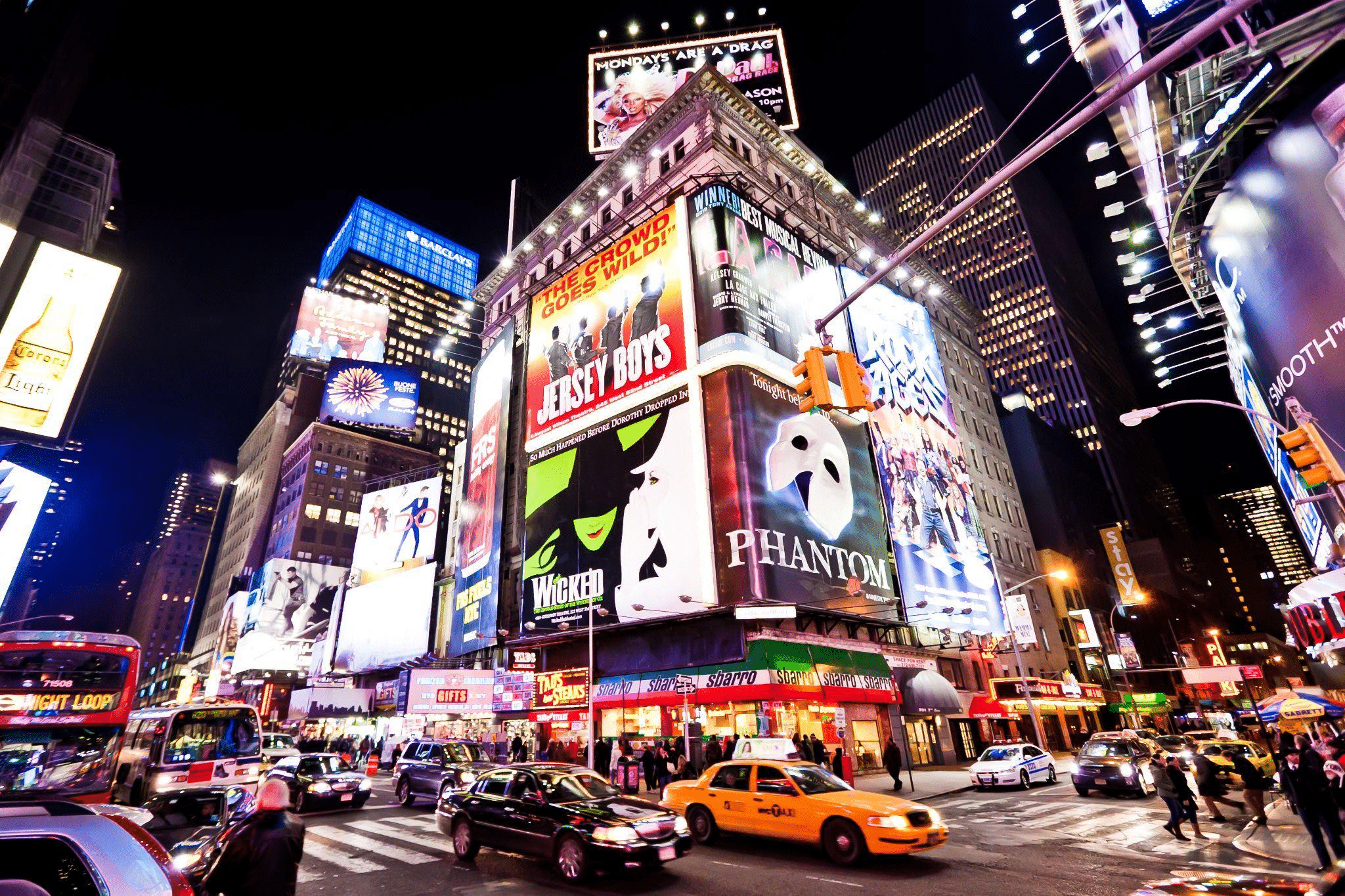 Theater marquees illuminate Broadway in New York.