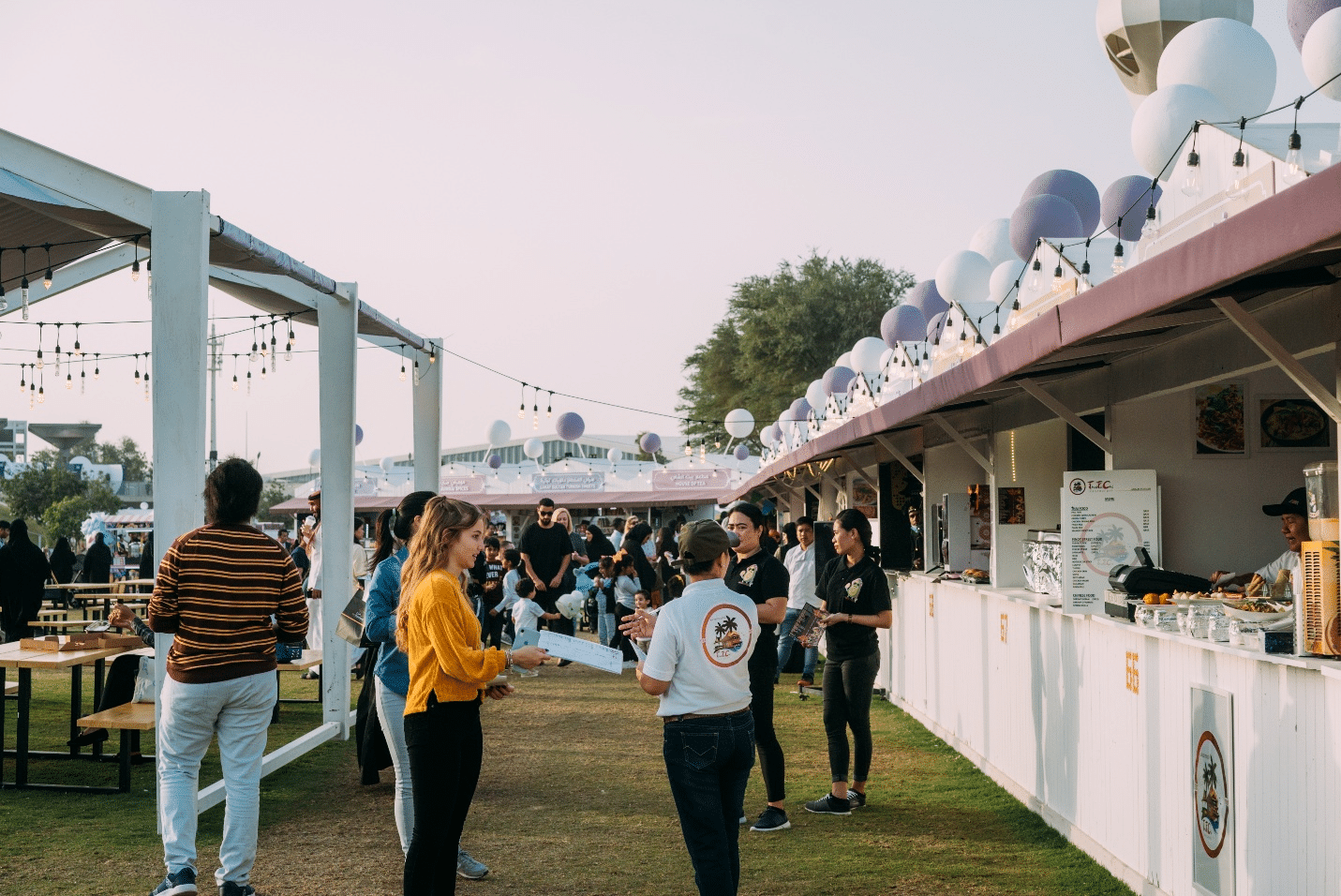 People standing at a food festival during a city trip to New York