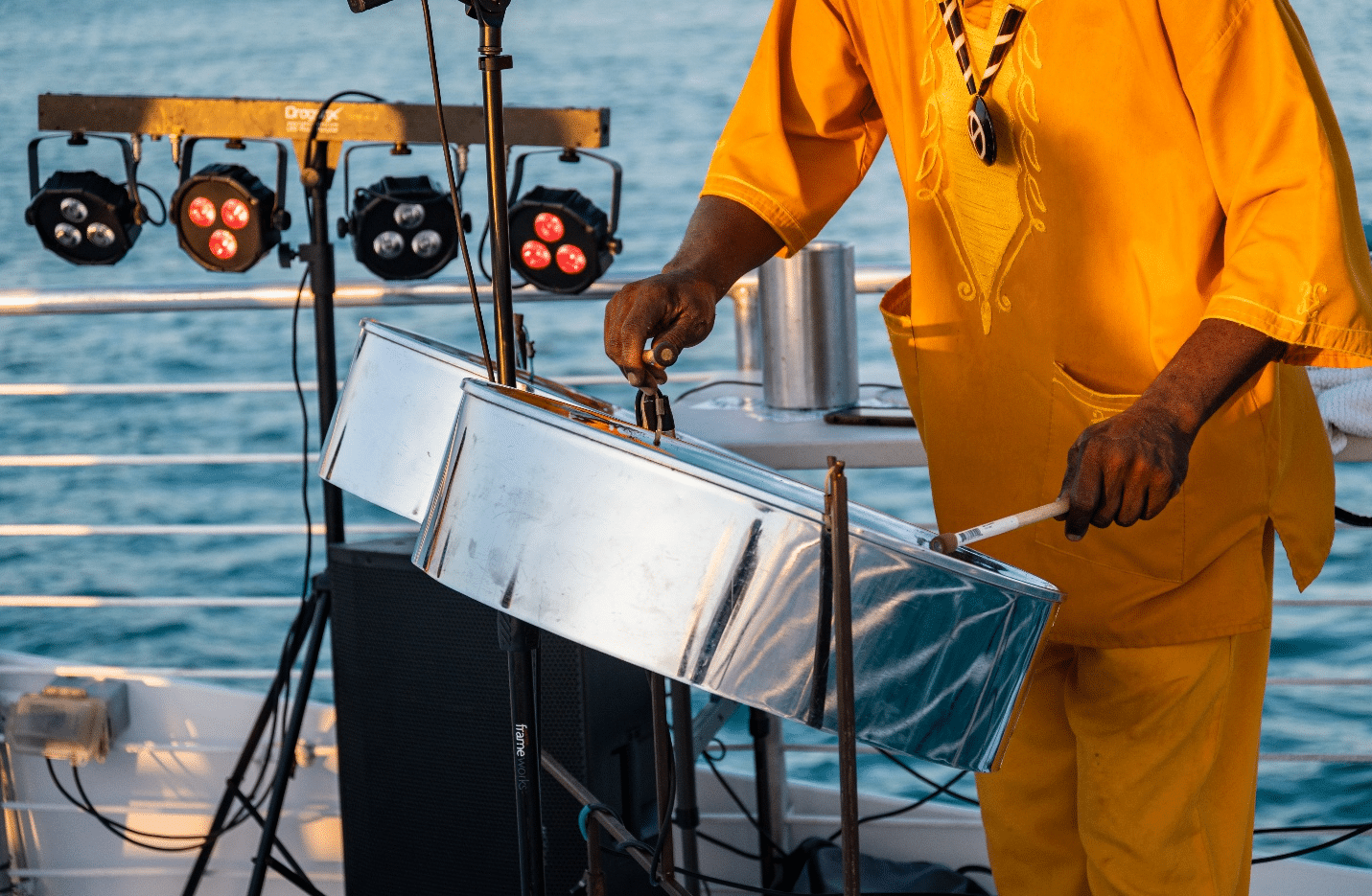 A man in yellow playing drums during a one-day sightseeing tour