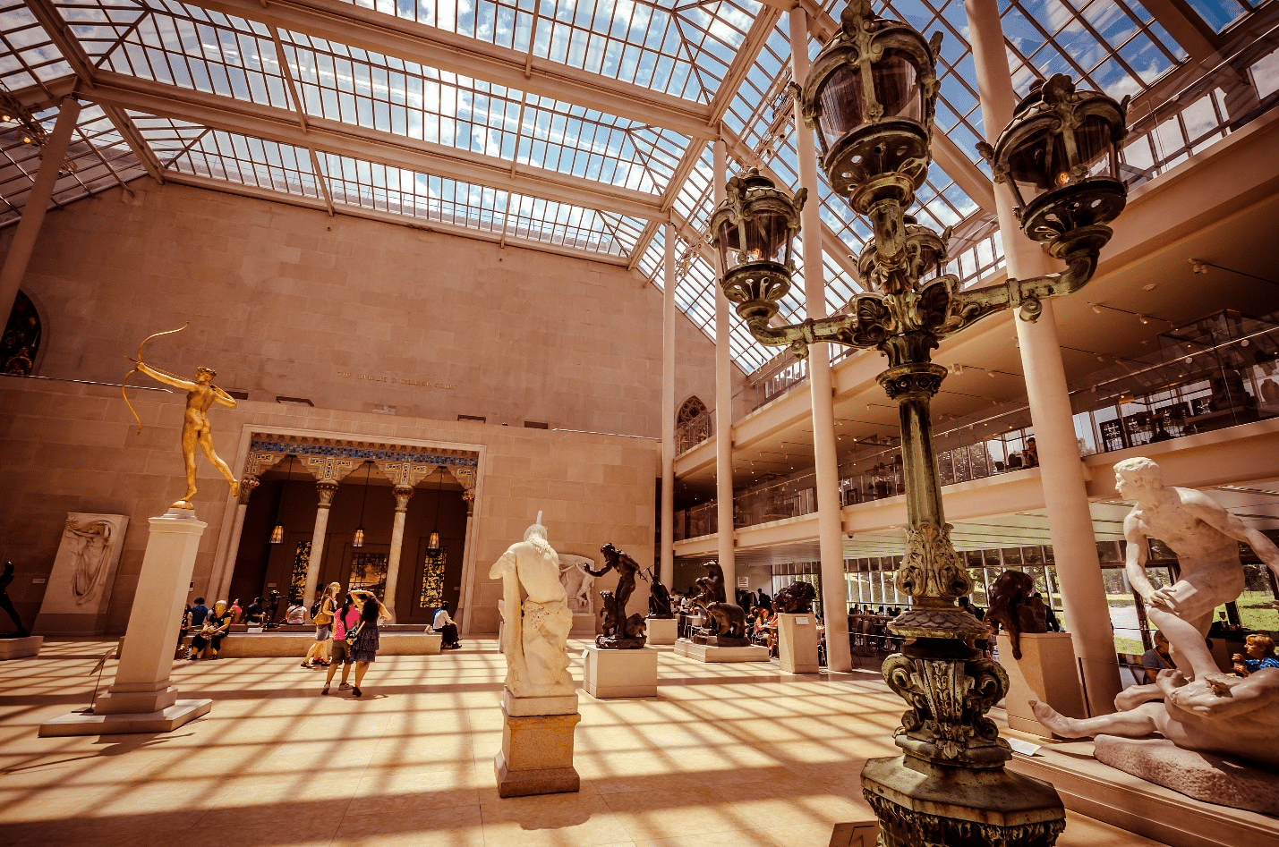 Statues and figures in a museum during a small group tour in New York City