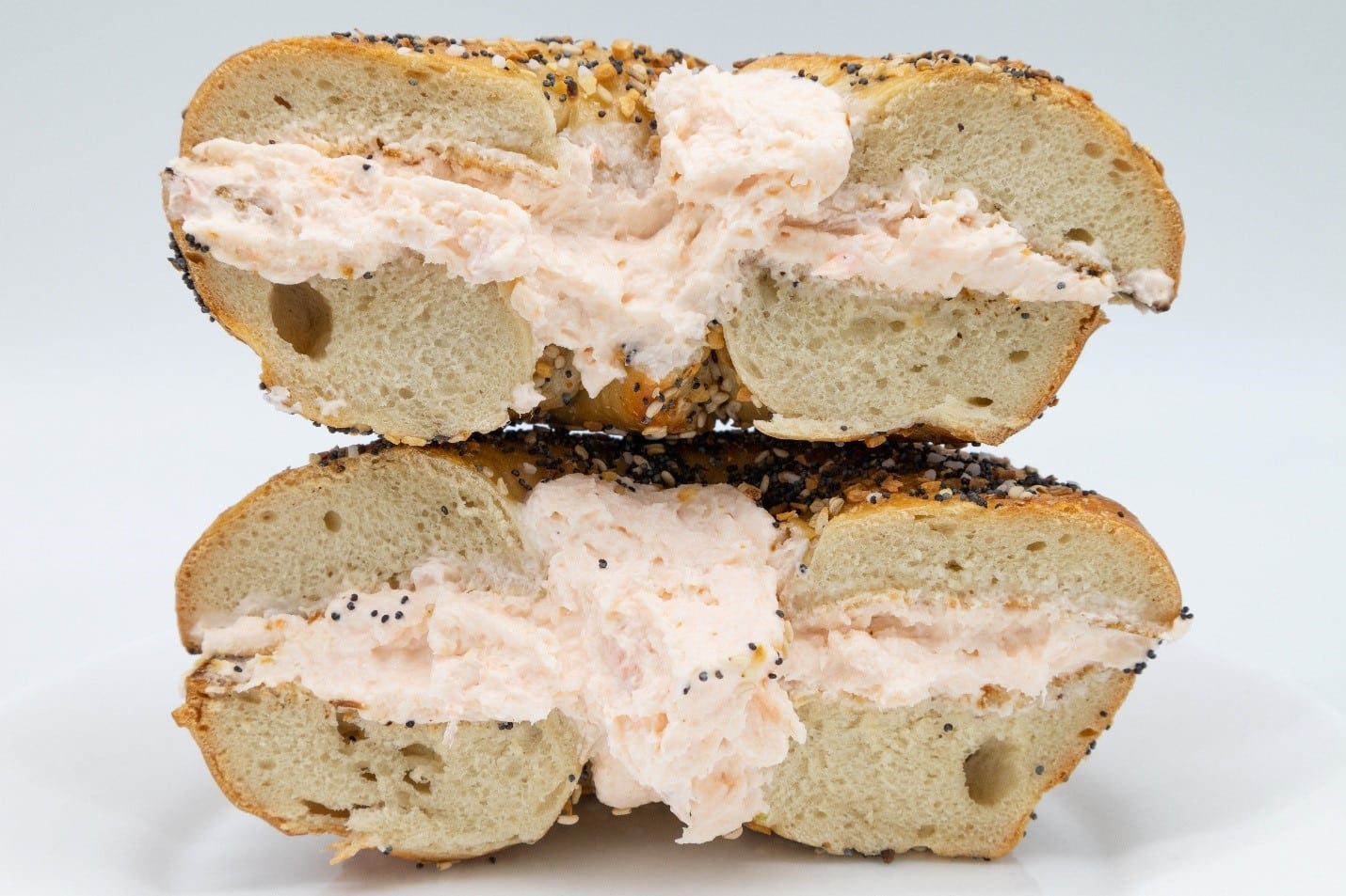 A bagel with cream cheese filling seen at aNew York City travel guide