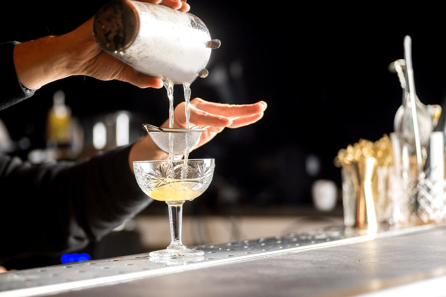 A person making a drink during a small group tour in New York City