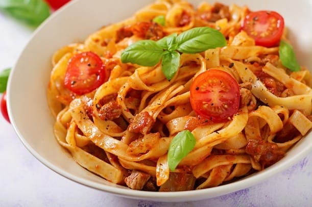 A bowl of tomato sauce pasta eaten duringa New York City travel guide