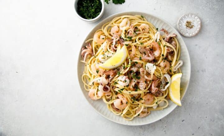 A plate of seafood pasta seen during a New York City travel guide