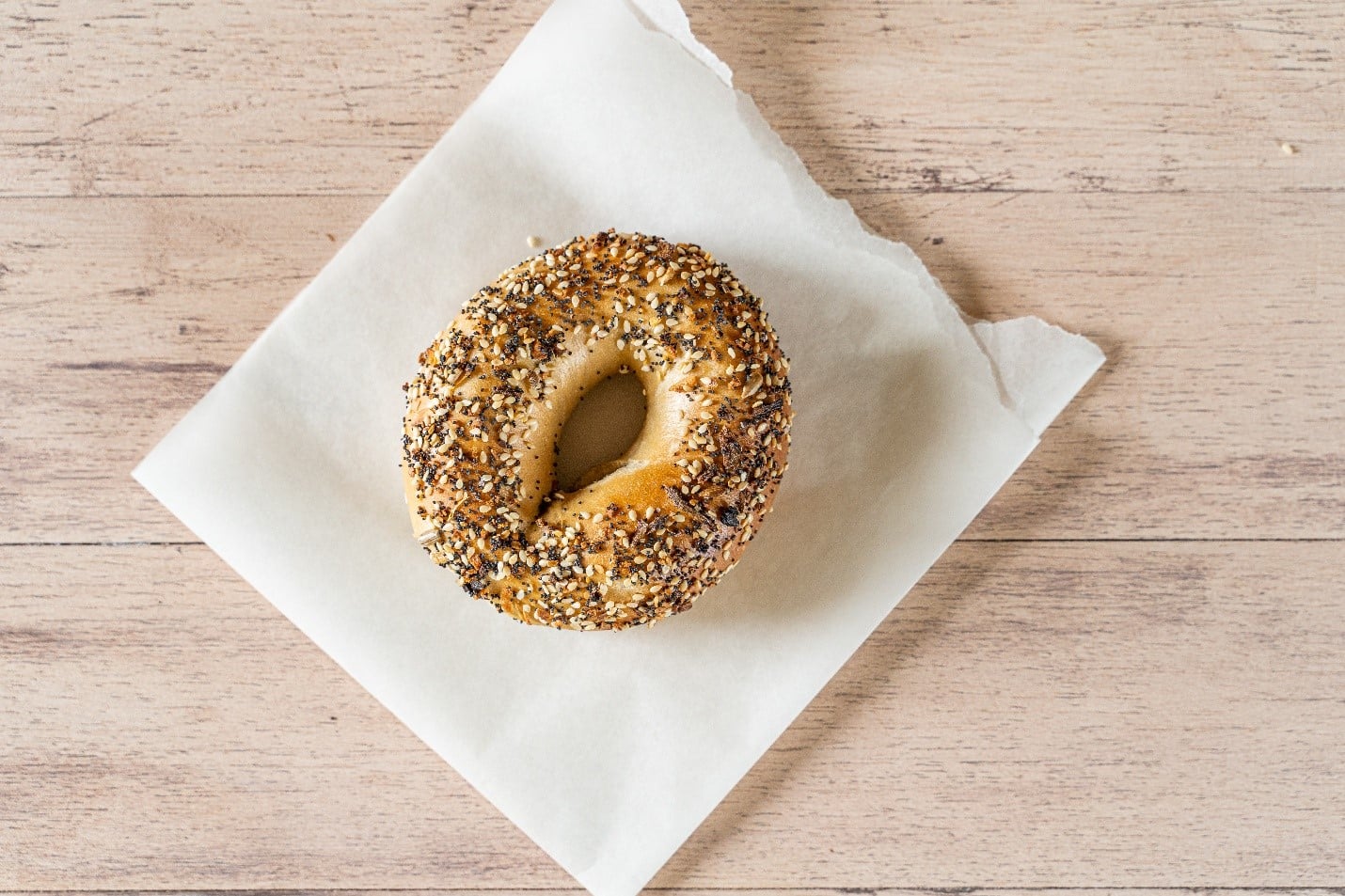 A seeded bagel eaten during asmall group tour in New York City