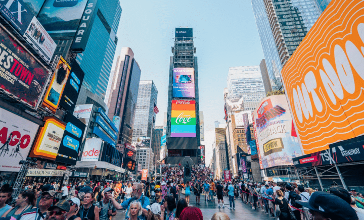 People walking in Times Square during a New York City travel guide