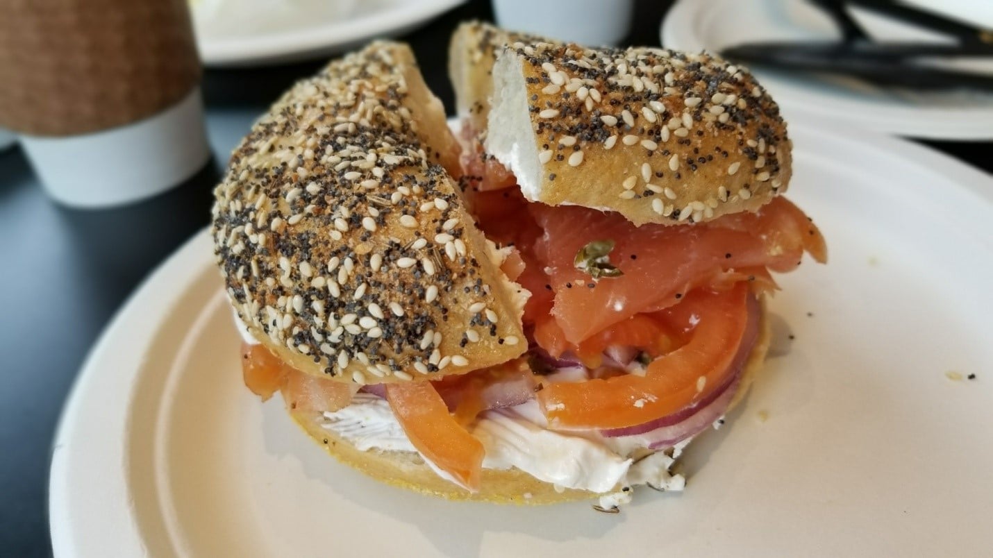 A bagel with tomato and onion filling seen during aNew York City travel guide