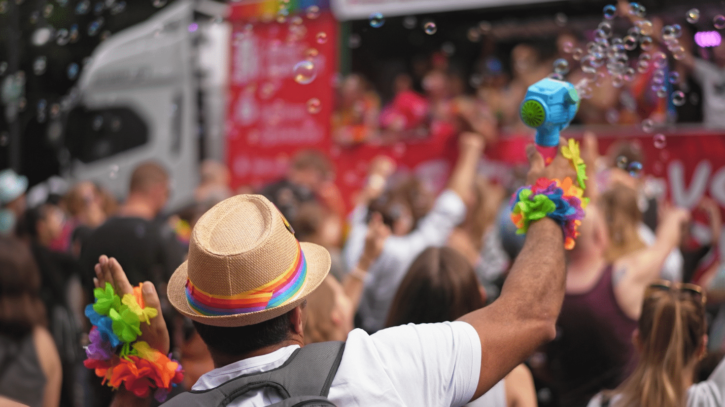 A person using a bubble gun at a concert
