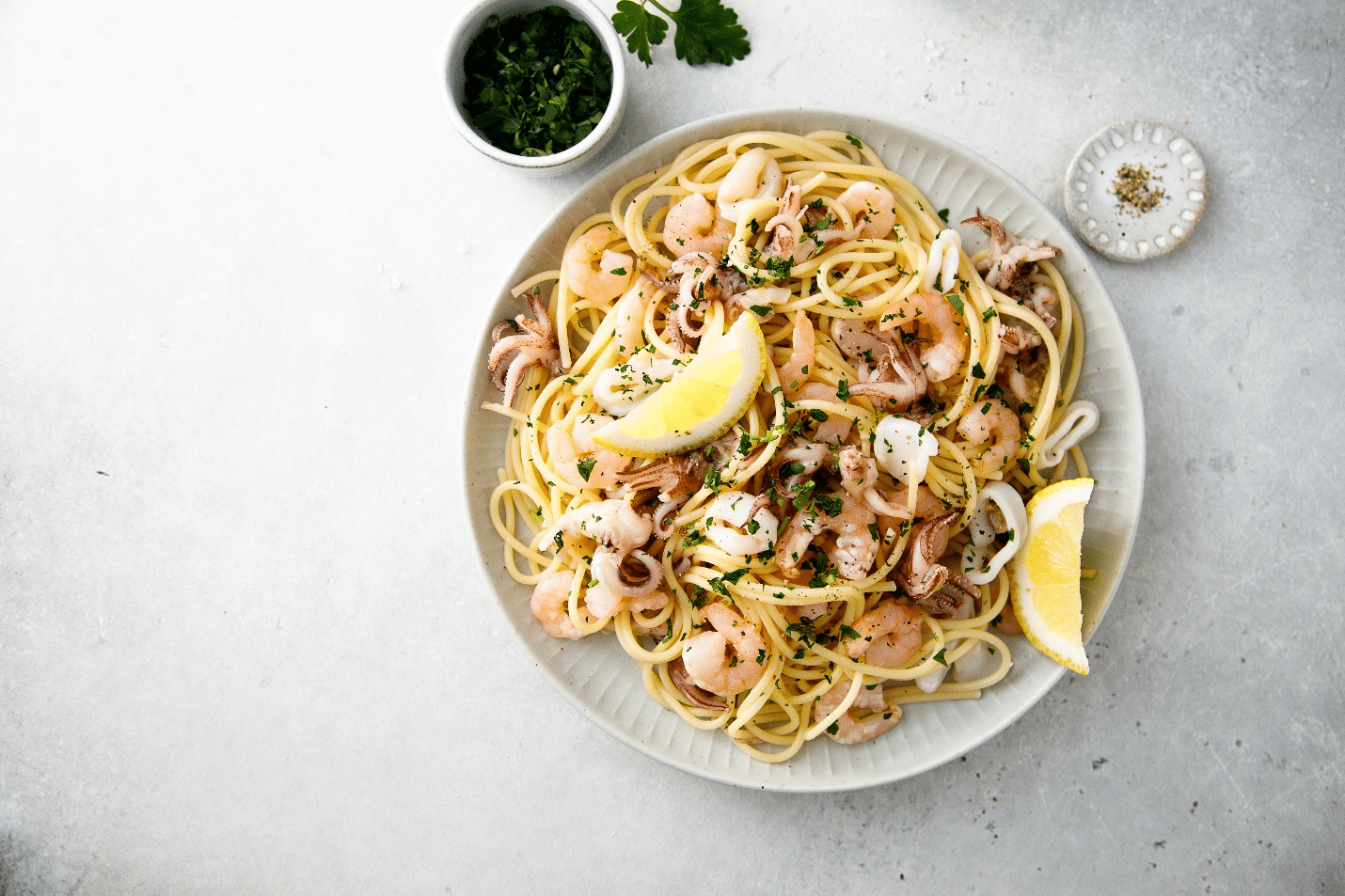 A plate of pasta and shrimp seen during New York City travel guide