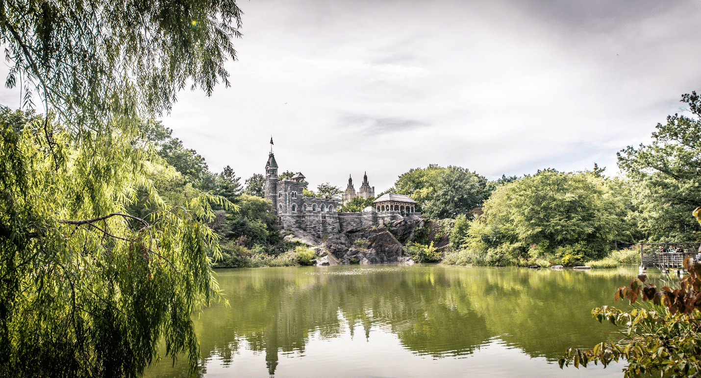A castle across a lake seen during a one-day sightseeing tour