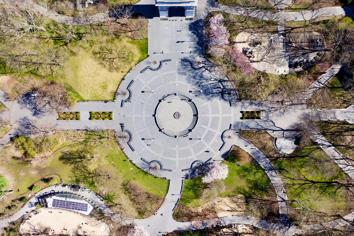 An aerial view of a circular paved area in Washington park during a New York City travel guide