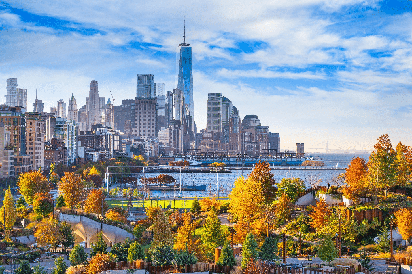 A park with a city view in the back seen during a New York City travel guide